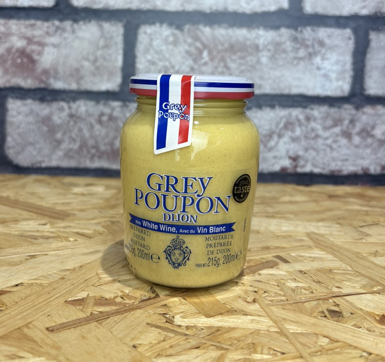 jar of dijon mustard with french flag label