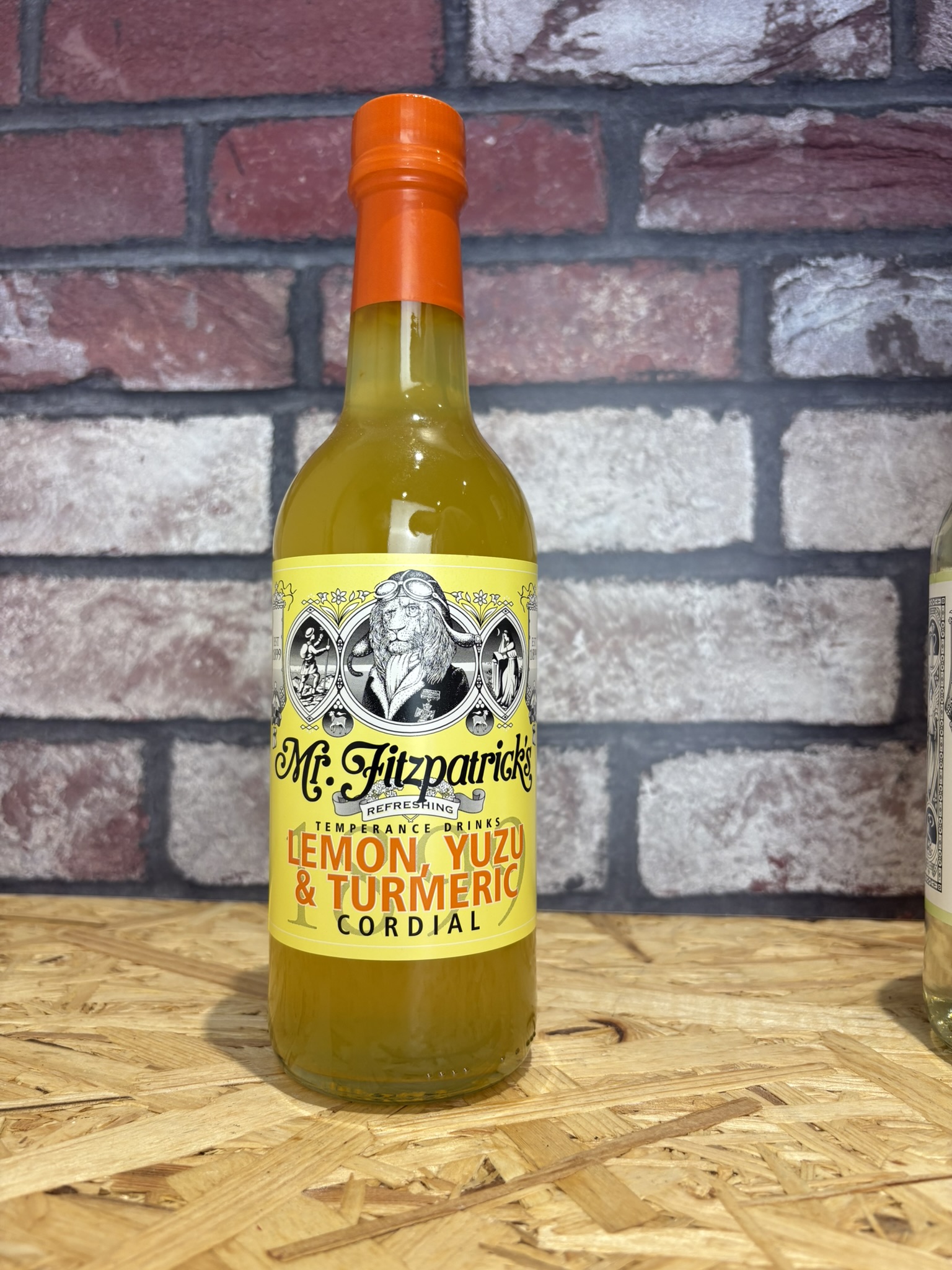 bottle of lemon yuzu and tumeric drink (yellow)