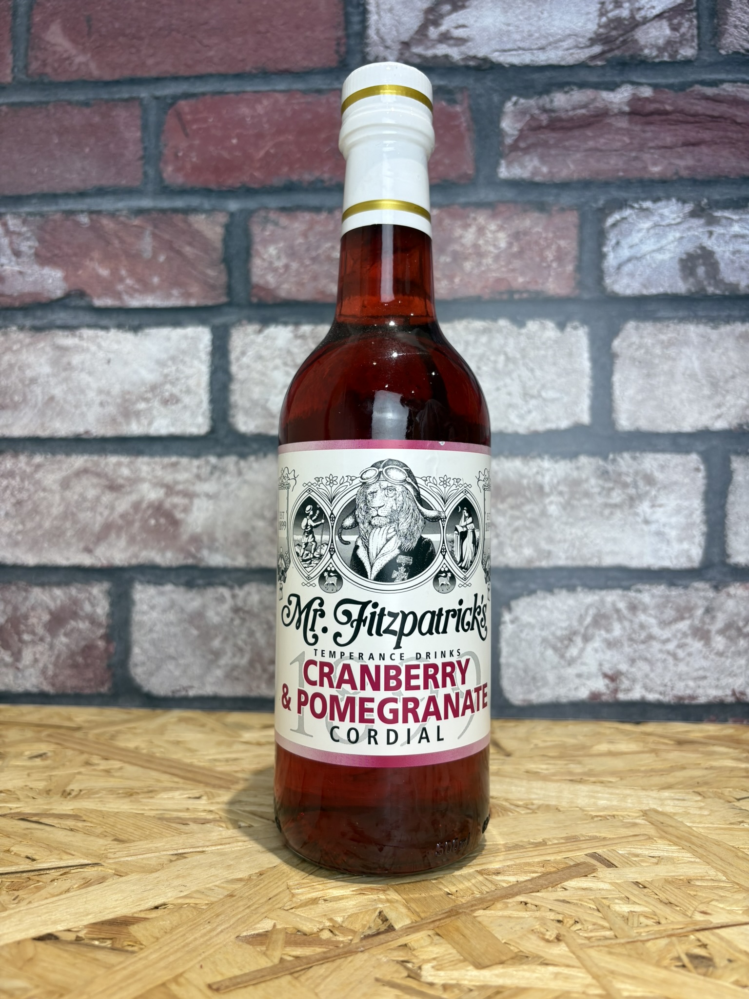 bottle of cranberry and pomegranate cordial- berry colour