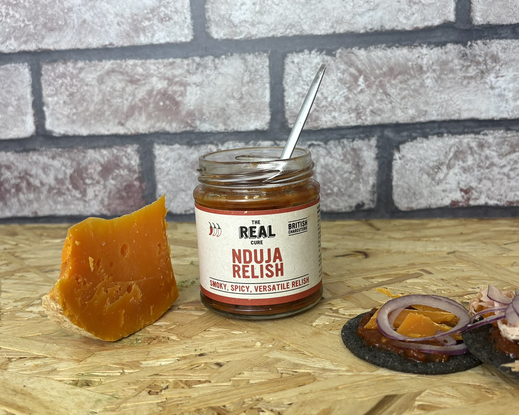 Nduja relish with Mimolette cheese and crackers
