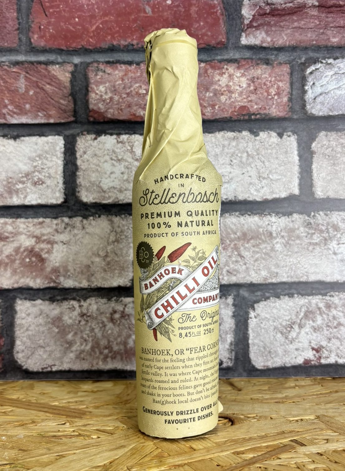 bottle of chilli oil wrapped in paper
