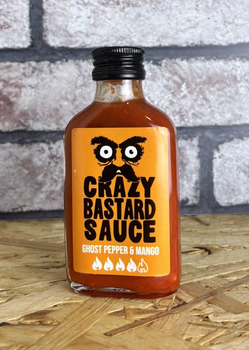 bottle of orange coloured hot sauce